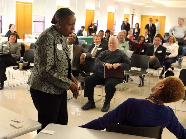 December, 2, 2010 - Branda Ellis, left, and Stephanie Henderson participate in an improvisational skill Thursday morning at the conclusion of the Bounce Back St. Louis informational meeting at the Shrewsbury City Center. J.B. Forbes